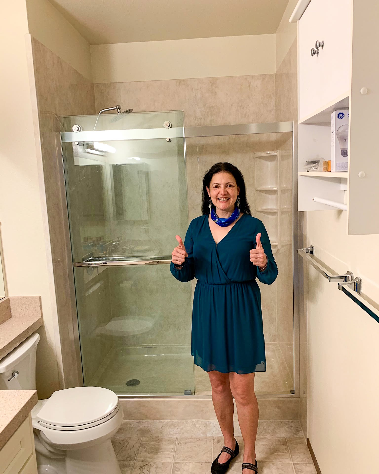 Happy customer with their new walk-in shower