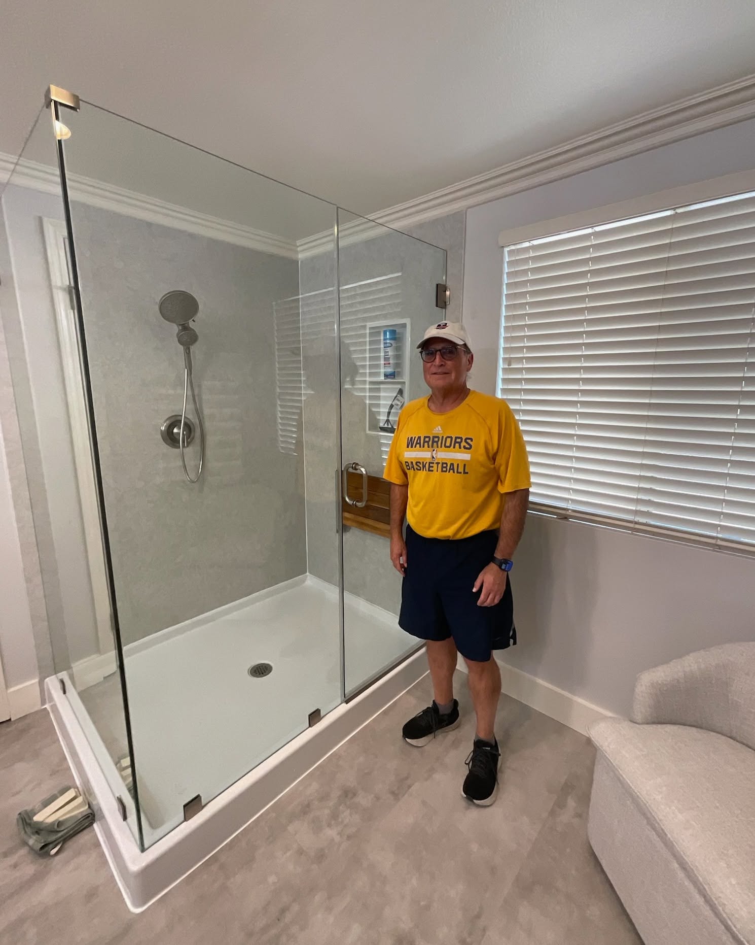 Happy customer with their new walk-in shower