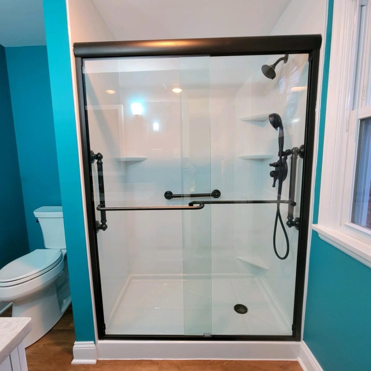 Happy customer with their new walk-in shower