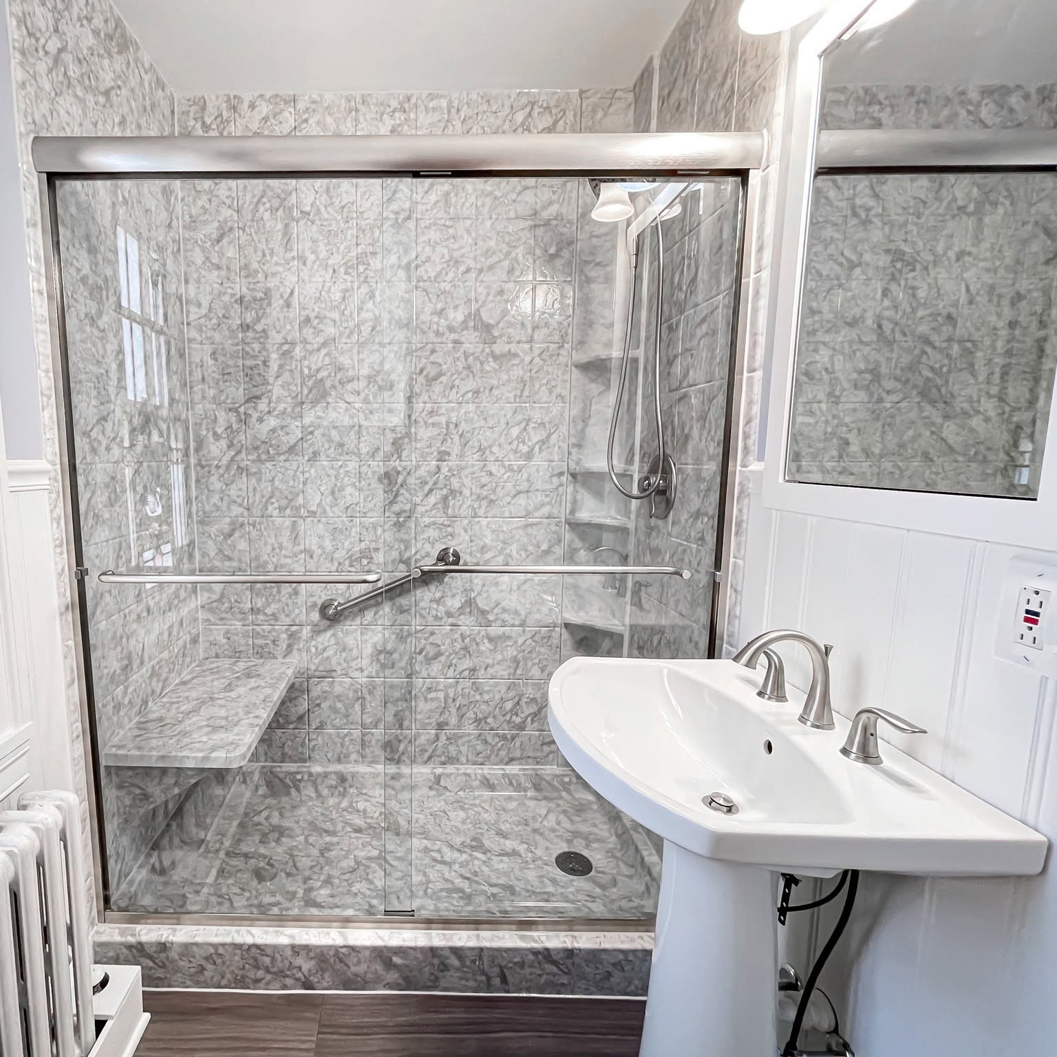 Happy customer with their new walk-in shower
