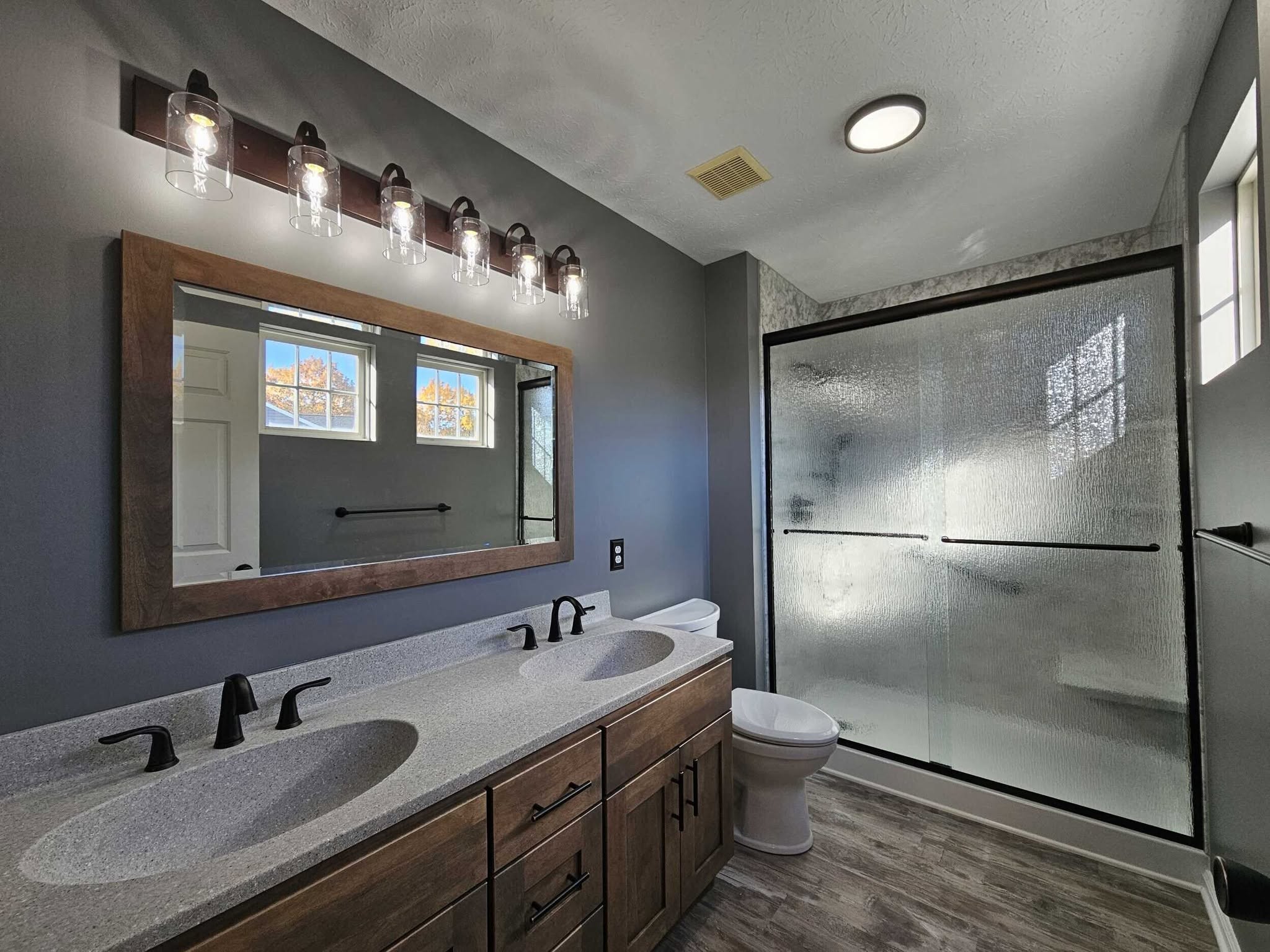 Happy customer with their new walk-in shower